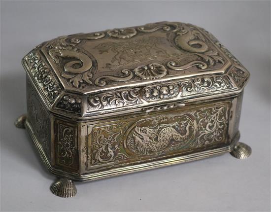 An early 20th century continental Arts & Crafts embossed white metal casket, on shell feet, 24 oz.